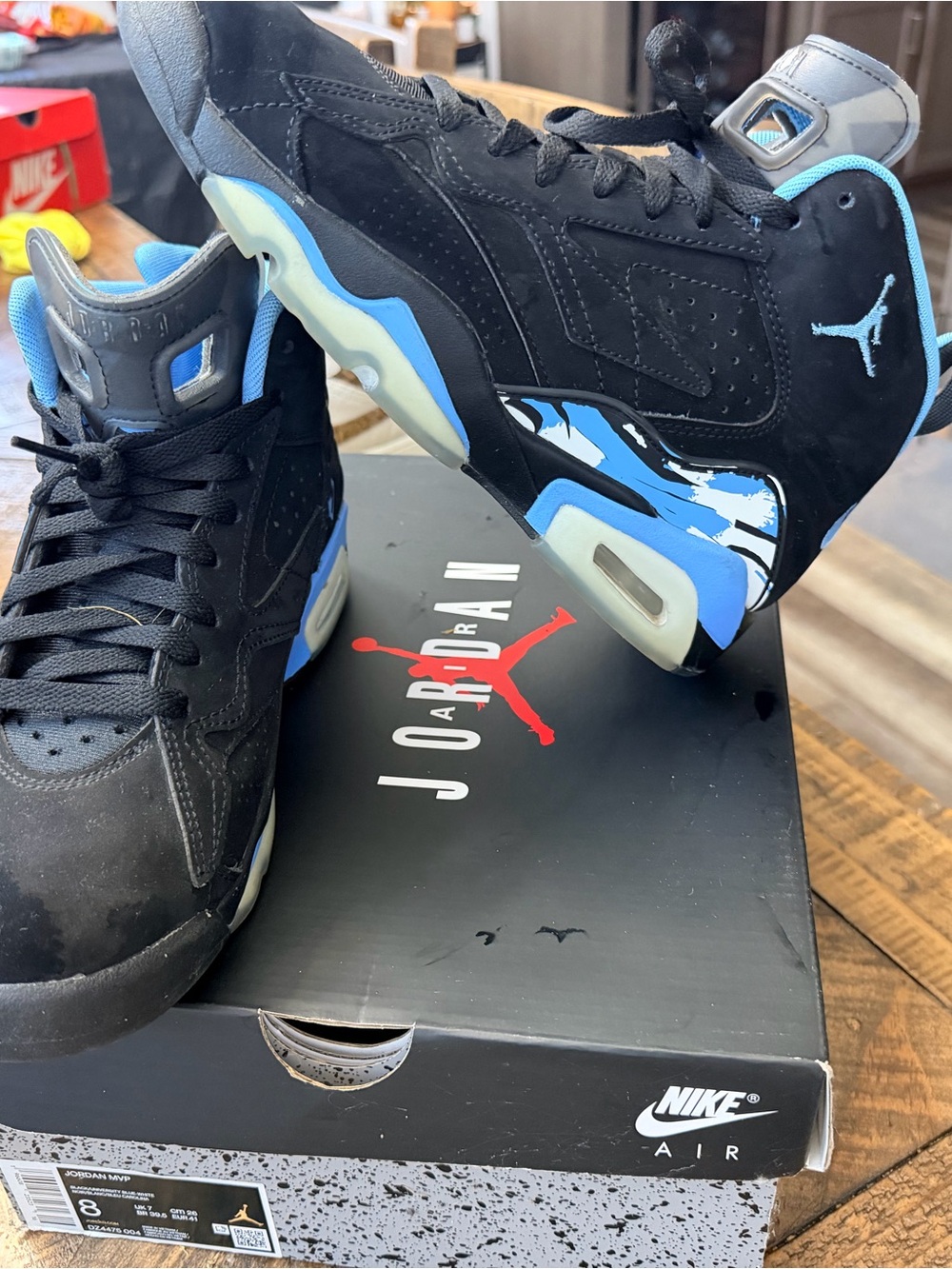 Jordan Men’s Black and University Blue Retro Sneakers